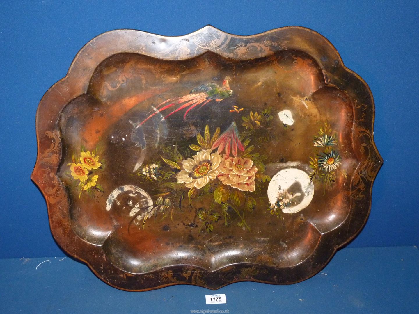 A metal tray with shaped edge painted with exotic bird and flowers, 25" x 19 1/2".
