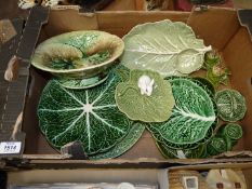 A quantity of leaf/cabbage ware including condiment set, bowls plates small rabbit dish,