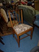 A Mahogany framed side Chair standing on tapering square legs and having a floral-patterned drop-in