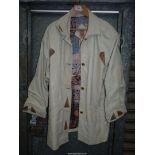 A lady's Spanish lambskin leather three-quarter length Coat in cream with snake skin panels and