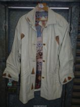 A lady's Spanish lambskin leather three-quarter length Coat in cream with snake skin panels and