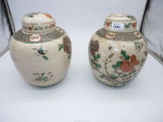 A pair of Oriental crackle glazed poly chrome ginger jars,