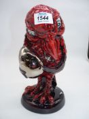 A Limited Edition (no: 21/100) 'Peggy Davies' Studio Grotesque bird figure 'Secret Keeper' in ruby