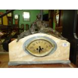 An elegant Art Deco French grey and cream marble cased mantel clock having an elliptical face with