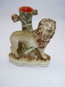 A circa 1840 Staffordshire pottery Lion spill vase,
