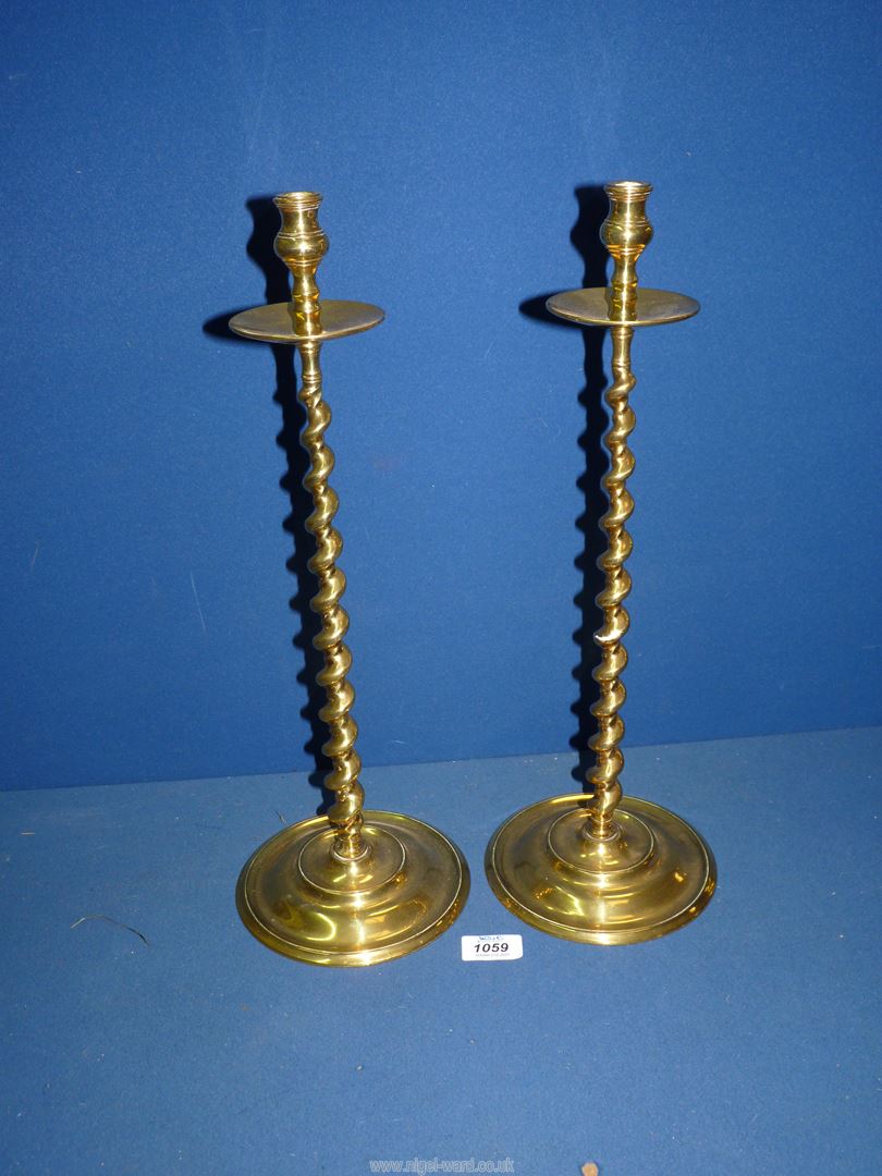 A heavy pair of brass altar Candlesticks with barley twist stem, 18" tall.