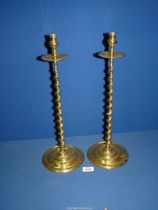 A heavy pair of brass altar Candlesticks with barley twist stem, 18" tall.