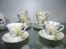 A Royal Stafford 'Broom' tea set, six cups and saucers and six tea plates.