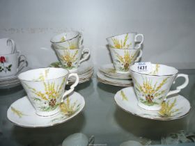 A Royal Stafford 'Broom' tea set, six cups and saucers and six tea plates.