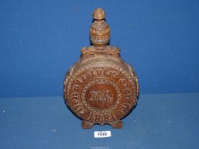 A 19th century Austrian heavily carved decorative moon shape circular wooden Flask with coat of