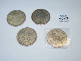 Four large reproduction Chinese coins, three with portraits, one with dragon, 107.5g total.