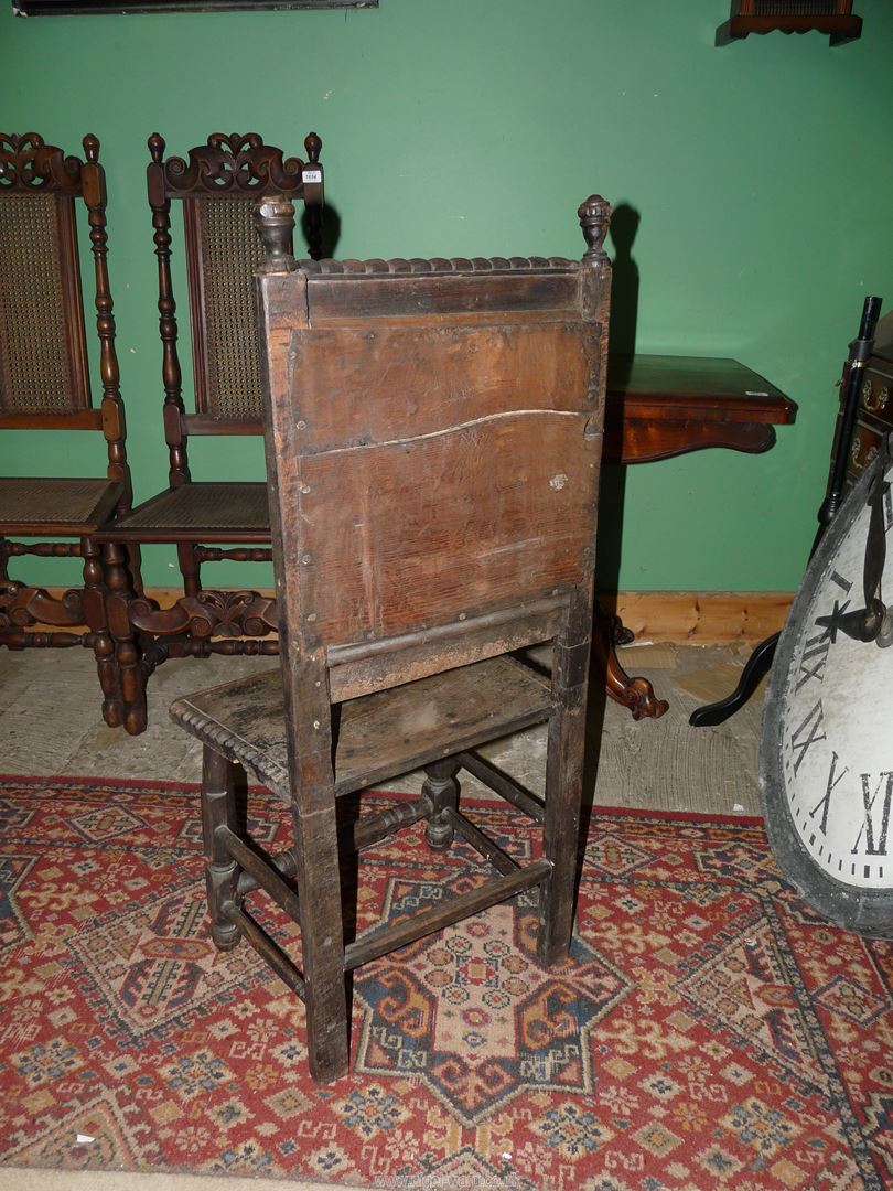 A rustic dark-wood hall chair for restoration having carved details to the backrest, - Image 2 of 2
