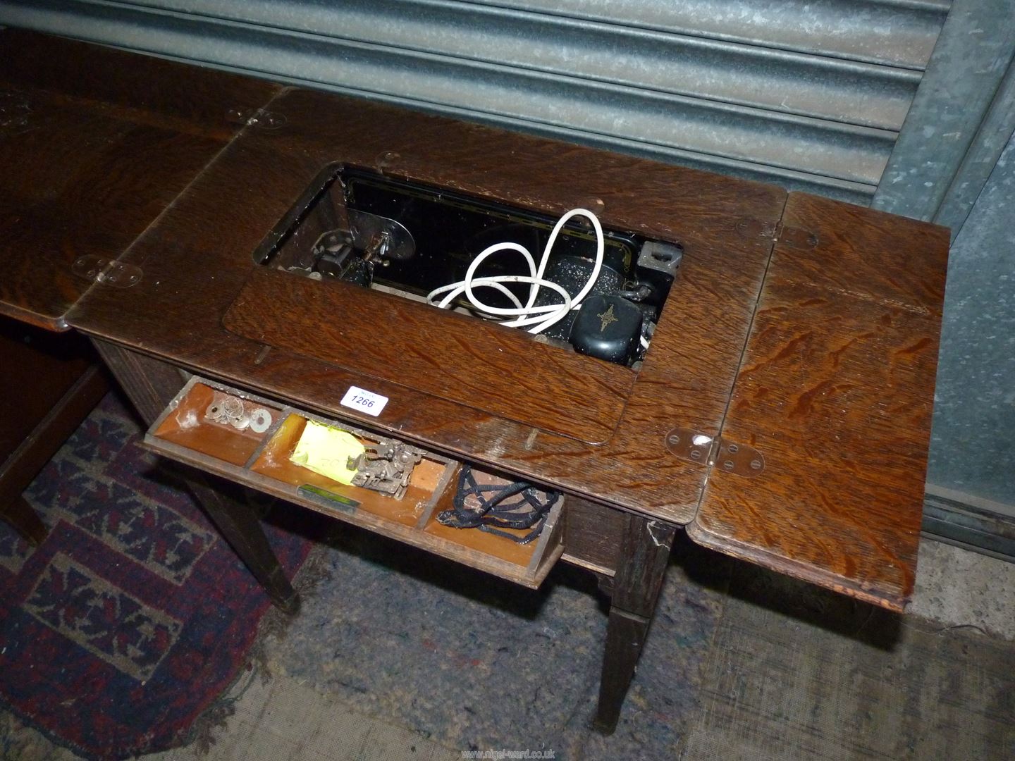 An Oak table contained Metamorphic Singer electric sewing machine folding down to form a table when - Image 5 of 7