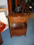 A bow-fronted mixed woods cross-banded bed/side cabinet having an upper pair of frieze drawers,