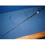 A sword having decoratively scroll-engraved triangular fullered blade,