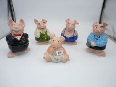 A set of five National Westminster Bank Piggy banks, all with stoppers.