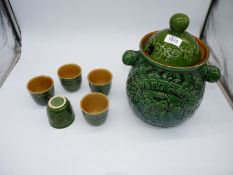 A green West German punch bowl with five cups.