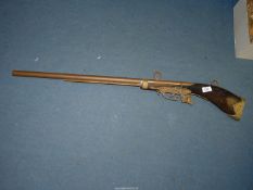 A replica Rifle for display purposes with boar head detail and wall mountings, 42" long.