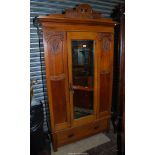 A Satinwood single Wardrobe having carved details,