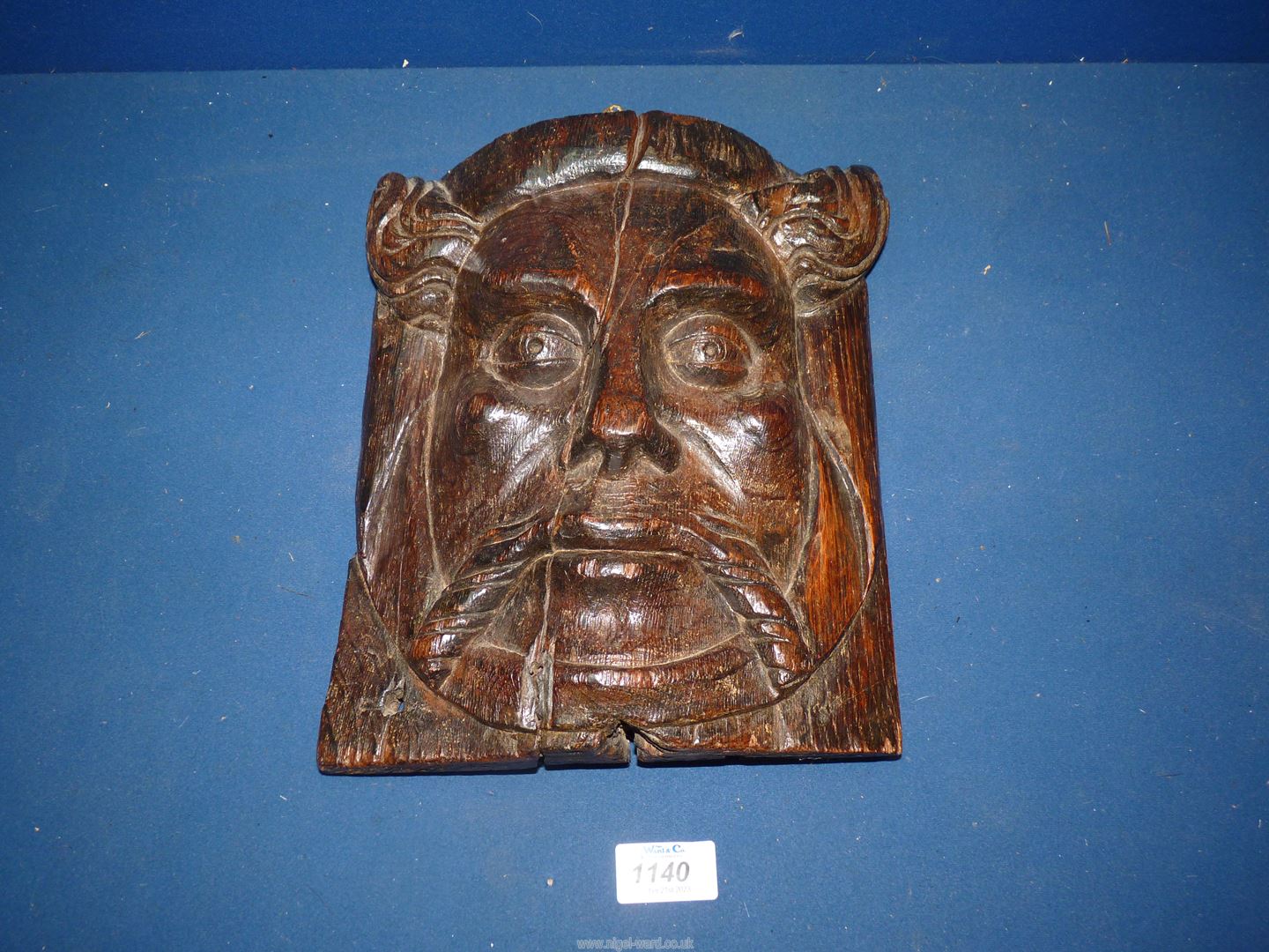 An Oak carved wall mask of a bearded Gentlemen, with hook hanger to rear, 10" high x 9" wide approx.