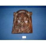 An Oak carved wall mask of a bearded Gentlemen, with hook hanger to rear, 10" high x 9" wide approx.