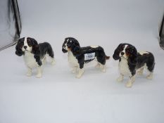 Three Beswick figures of King Charles Spaniels.