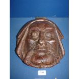 An Oak carved wall Mask of a Gent possibly a monk, with hook hanging to rear,