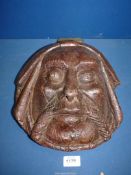 An Oak carved wall Mask of a Gent possibly a monk, with hook hanging to rear,