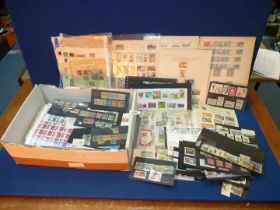 A cardboard box of stamps and part stock books.