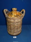 A large Stoneware bottle dated 1823, marked 'Mackenzie and Company, Wine and Spirit Merchants,