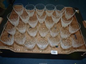 A set of thirteen red wine glasses and matching set of fourteen white wine glasses.