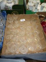 A quantity of fine glass drinking glasses with gold rims including: tumblers, wine and sherry.