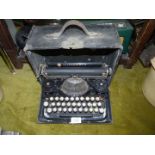 A vintage Underwood typewriter with case.