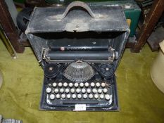 A vintage Underwood typewriter with case.