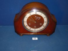 An Alexandra Clark Co Ltd Mantle Clock with key and pendulum, 9 1/2" tall x 12" wide.