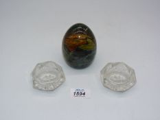 A multi-coloured glass dump paperweight with swirl decoration and a pair of 19th century fine slice