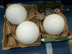 Three spherical opaque glass light shades with four light fittings 10" diameter.