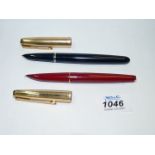 A black Parker 51 fountain pen and a burgundy Parker 61 fountain pen,