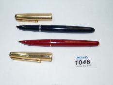 A black Parker 51 fountain pen and a burgundy Parker 61 fountain pen,