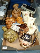 A trio of Staffordshire pottery jugs with floral design , four Sadler storage jars and a teapot etc.