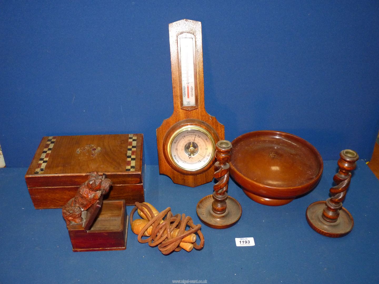 A quantity of treen including candlesticks, novelty cigarette box, skipping rope, sewing box,