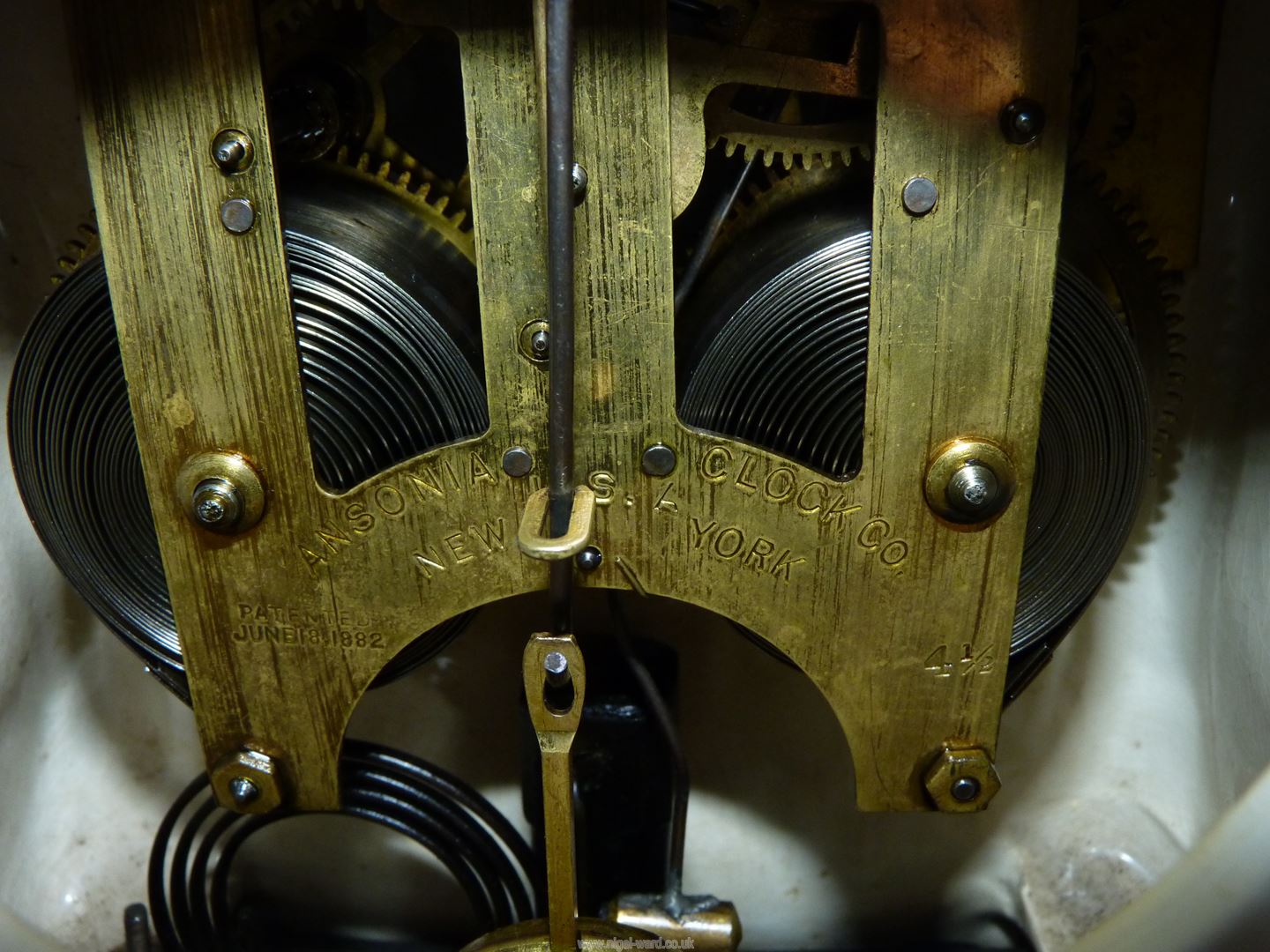 An Ansonia chiming Mantle Clock with Bonn china casing having Roman numerals to the cream face and - Image 3 of 4