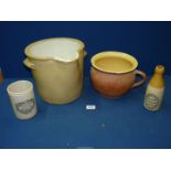 A Stoneware pot with a pouring lip (cracked), Wm Mitchell stoneware ginger beer bottle,