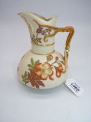 A Royal Worcester blush ivory ewer, hand painted, striking colourful flowers and twist gilt handle,