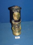 A metal and brass Miner's lamp by Hailwood & Ackroyd no. 1149.