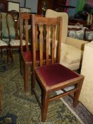 A pair of Oak framed side/dining chairs having maroon velvet type upholstered drop in-seats.