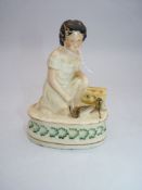 A Staffordshire pottery little girl with rats figure circa 1870 5 1,2" high x 4" wide.