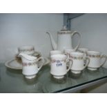 A Paragon 'Belinda' coffee set to include; coffee pot, sugar bowl, milk jug,