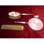 A Silver dressing table set including mirror, brush and comb,