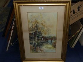 A framed and mounted Watercolour/gouache of a riverside scene, lady stood next to her boat,